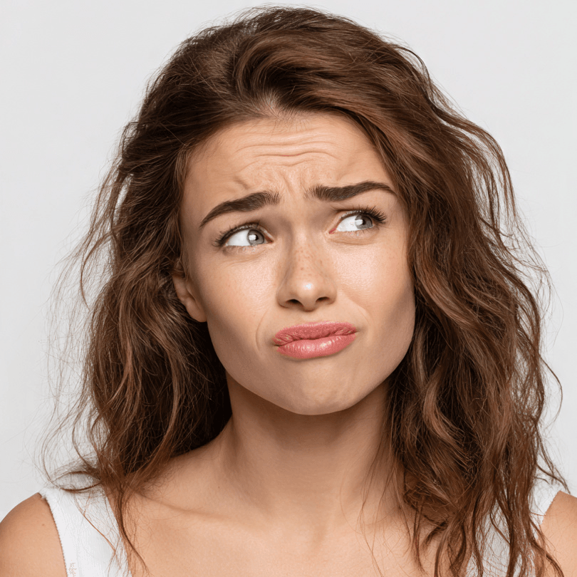 beautiful woman holding wrong facial cleanser
