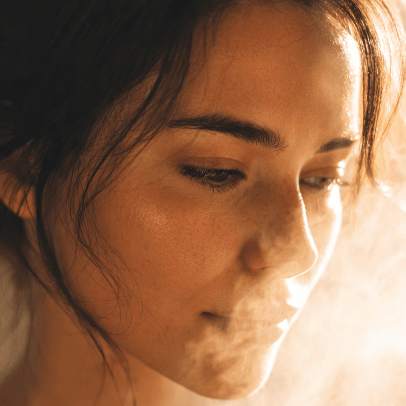 beautiful woman with steam rising from